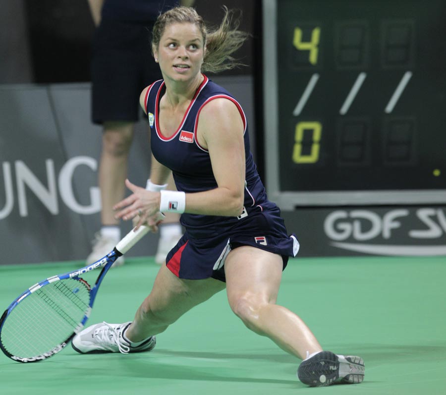 Kim Clijsters skids across the court