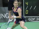 Kim Clijsters stretches to reach the ball