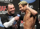 Josh Koscheck listens to the crowd boo him after making weight at the UFC 124 weigh-in