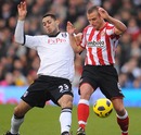 Clint Dempsey and Lee Cattermole battle for the ball