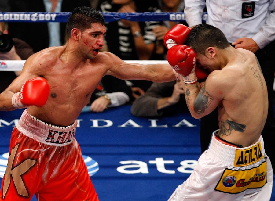Amir Khan forces Marcos Maidana to cover up