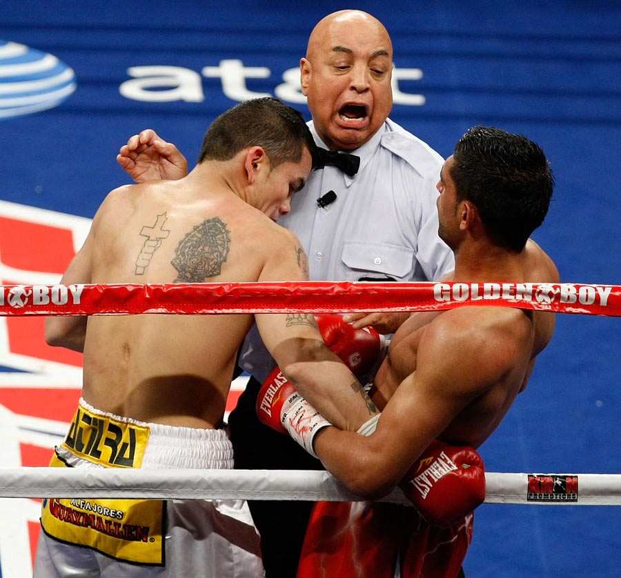 Referee Joe Cortez steps in to separate Amir Khan and Marcos Maidana