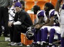 Brett Favre watches the action from the bench