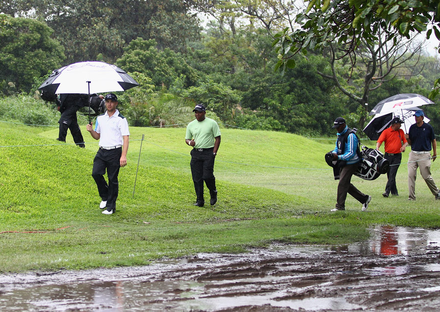 Players return to the clubhouse as rain stops play 