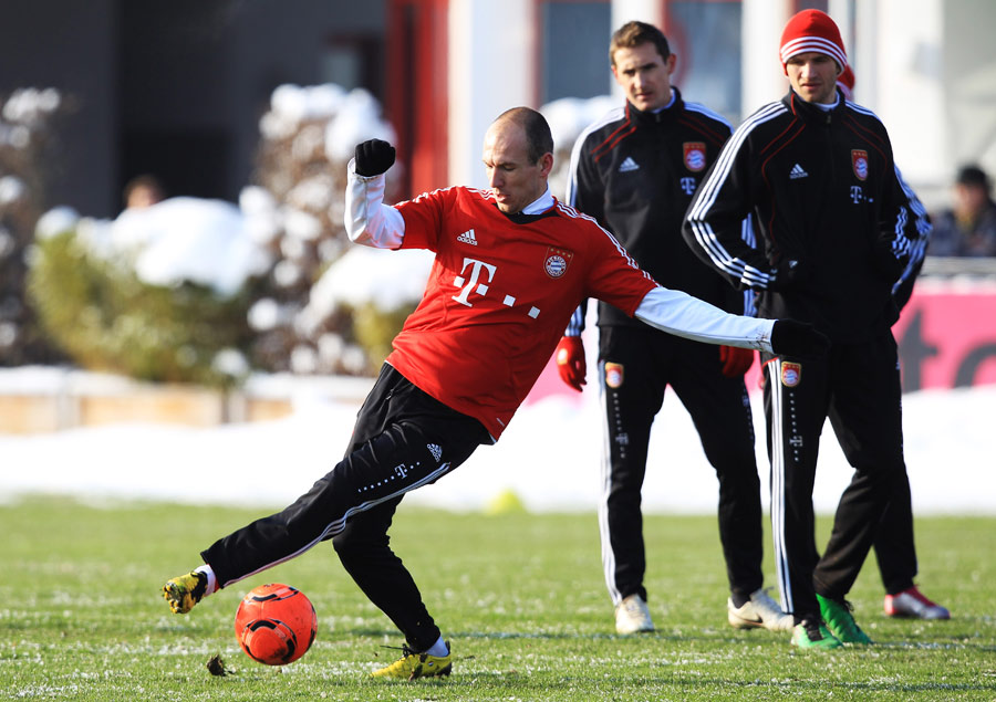 Arjen Robben struggles to control the ball