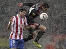 Raul Garcia and Hanno Balitsch challenge for a header
