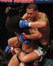 Anthony Pettis looks to take the back of Ben Henderson