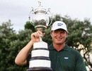 Ernie Els poses with his trophy