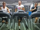 Australian Davis Cup squad members Matt Ebden, Marinko Matosevic and Peter Luczak run on treadmills
