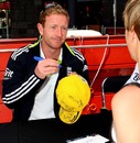 Paul Collingwood signs his autograph for a fan during an Ashes fan day