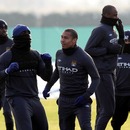 Manchester City players train in the cold
