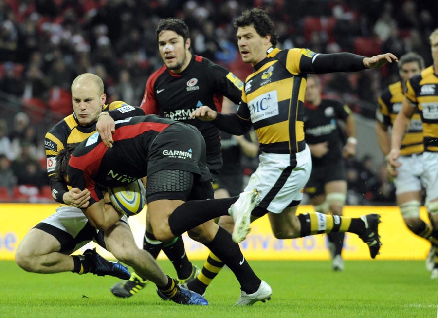 Saracens replacement Gavin Henson is tackled just short of the line
