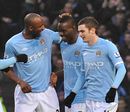 Mario Balotelli is congratulated after his penalty strike