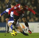 Patrice Evra and Craig Gardner battle for the ball
