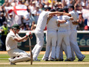Brad Haddin sinks to his knees as England celebrate the matchwinning wicket