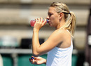 Maria Sharapova takes a drink during practice