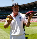 Andrew Strauss poses with a broken replica urn after the Ashes were retained