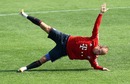 Arjen Robben stretches during training