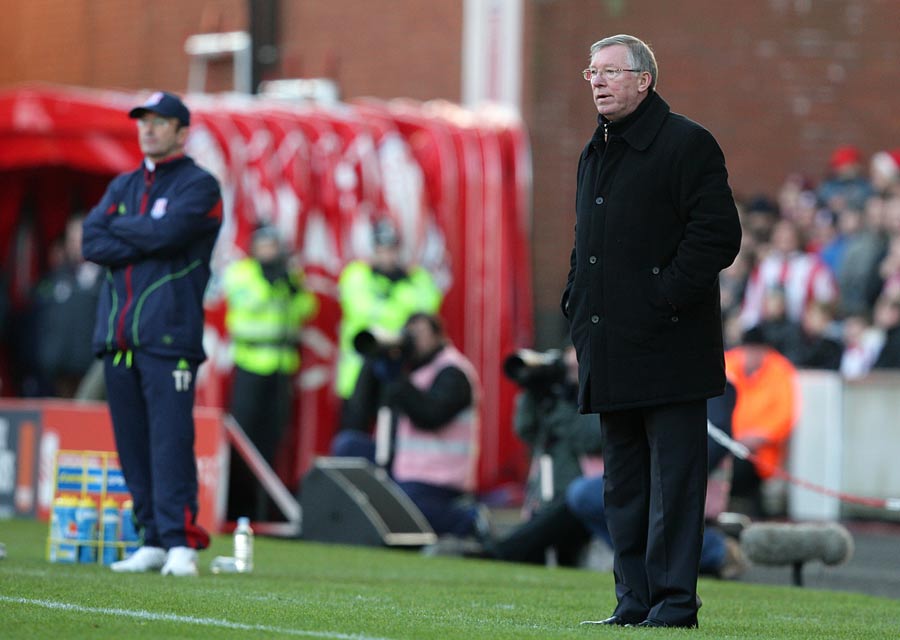 Tony Pulis and Sir Alex Ferguson watch the action