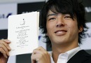 Ryo Ishikawa shows his invitation to the Masters