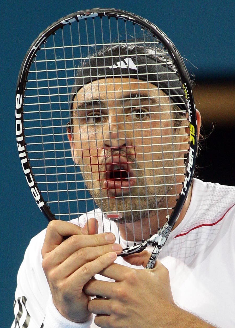 Marcos Baghdatis hides behind his racket