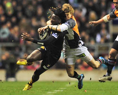 Wasps Paul Sackey is tackled by Harlequins' David Strettle