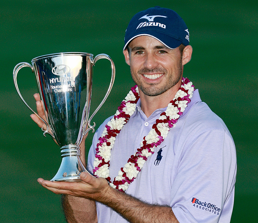 Jonathan Byrd shows off his trophy and his lei