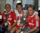 Kenny Dalglish celebrates with coaches Ronnie Moran and Roy Evans