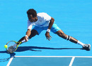 Gael Monfils stretches for a forehand