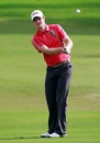 Justin Rose plays a shot on the 18th hole