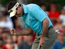 Mark Wilson reacts to a par putt on the 17th hole