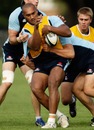 The Waratahs' Nemani Nadolo is tackled during a training session