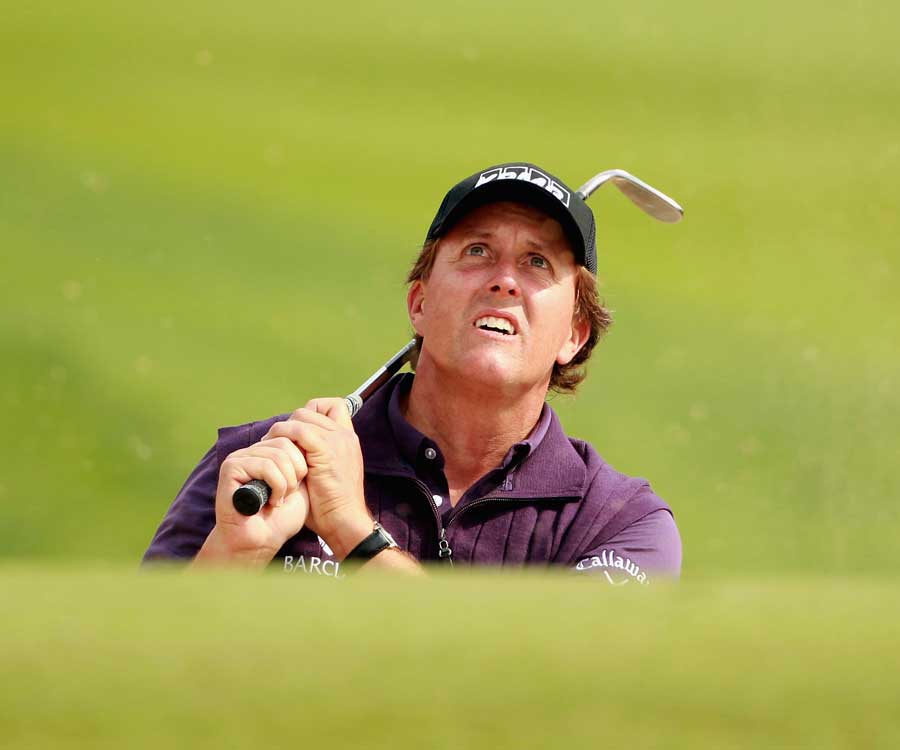 Phil Mickelson keeps an eye on his shot