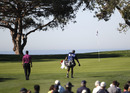 Tiger Woods and caddie Steve Williams approach the scenic 12th green at Torrey Pines