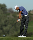 Tiger Woods puts his full weight behind his tee shot on Friday