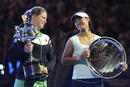 Li Na and Kim Clijsters stand with their trophies