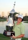 Rory McIlroy poses with the trophy after winning the 2009 Dubai Desert Classic