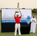 Lee Westwood of England poses with the Race To Dubai trophy after winning the 2009 Dubai World Championship