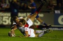 Sam Tomkins of England scores a try against Wales