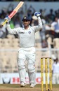 Virender Sehwag raises the bat on his way to scoring 293 for India against Sri Lanka