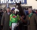 Trainer Paul Nicholls, jockey Ruby Walsh and owner Clive Smith pose after Kauto Star's win in the King George VI Chase