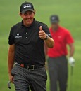 Phil Mickelson is all smiles as he strides on to the 18th green ahead of his win at the WGC - HSBC Champions