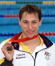 Ian Thorpe displays his gold medal after setting a new world record in the 200m men's freestyle