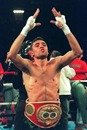 Oscar de la Hoya celebrates after beating Rafael Ruelas in their WBO/IBF lightweight bout