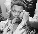 Joe Frazier speaks to the press after his bruising win against Muhammad Ali