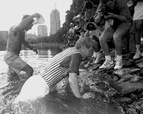 Jim Courier climbs up the bank of the Yarra River following the final of the Australian Open. 