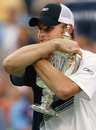 Andy Roddick hugs his US Open trophy