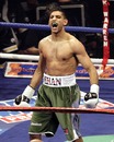 Amir Khan celebrates beating  Dmitriy Salita of  in their WBA light-welterweight title fight