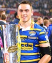 Kevin Sinfield of Leeds Rhinos pose with the trophy after winning the Super League Grand Final