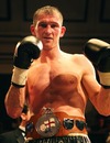 Lenny Daws poses after winning the light-welterweight title